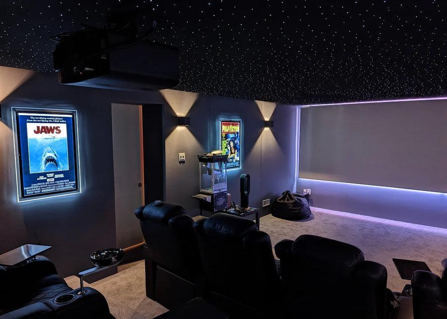 Star ceiling above a home theater with a ceiling-mounted projector in frame
