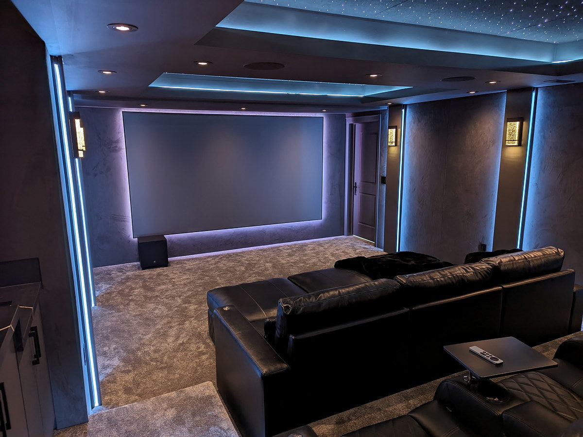 Home theater seating with illuminated star ceiling panels overhead