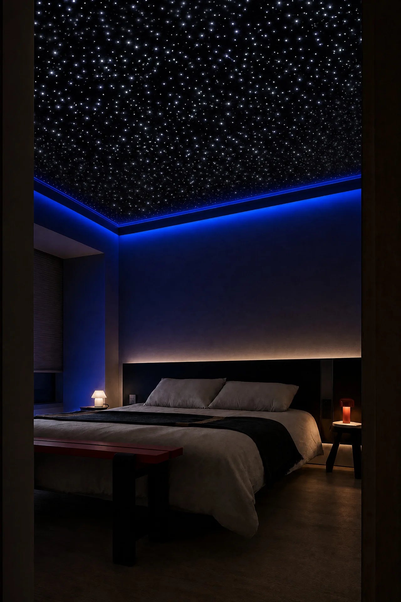 Modern bedroom with blue accent lighting and a bright white starlight ceiling